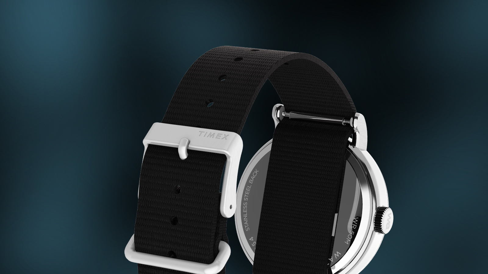 Rear view of Timex x Fortnite Weekender watch showing stainless-steel back and black nylon strap against dark teal background.