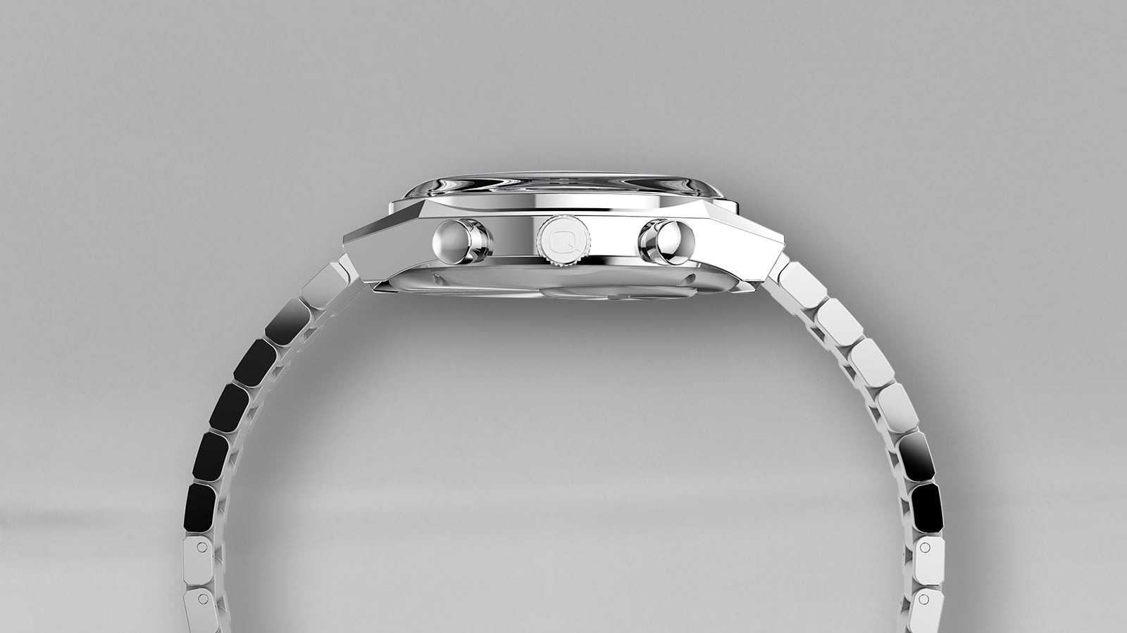 Side view of the Q Timex Falcon Eye Chronograph displaying the profile of the case, pushers, and crown with embossed Q logo, paired with a sleek stainless-steel bracelet.