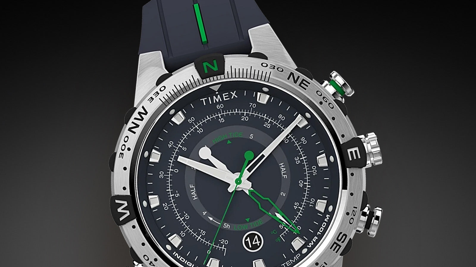 Close-up front view of the Timex Expedition Tide-Temp-Compass watch showing its detailed blue dial, luminous white hands, green indicators for tide and temperature, compass bezel, and date window at 6 o’clock.