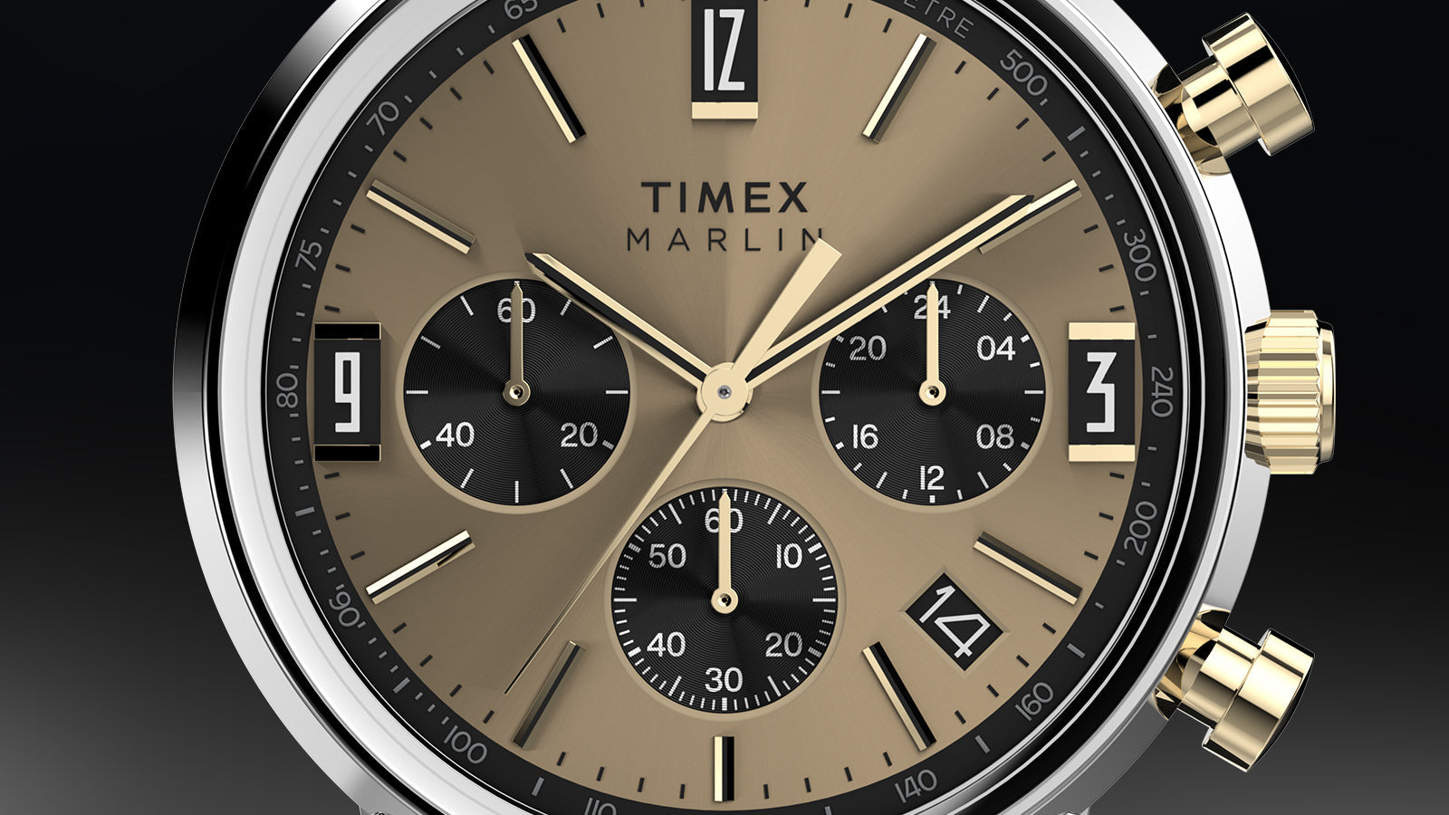 Close-up of Timex Marlin Chronograph Tachymeter champagne dial featuring gold-tone hands, black subdials, and tachymeter scale.