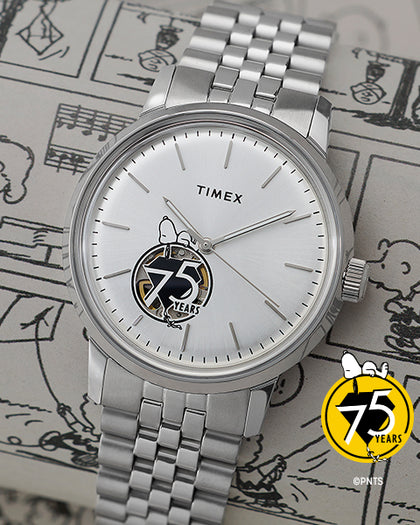 Silver Timex watch with a Snoopy design on a background with Peanuts illustrations