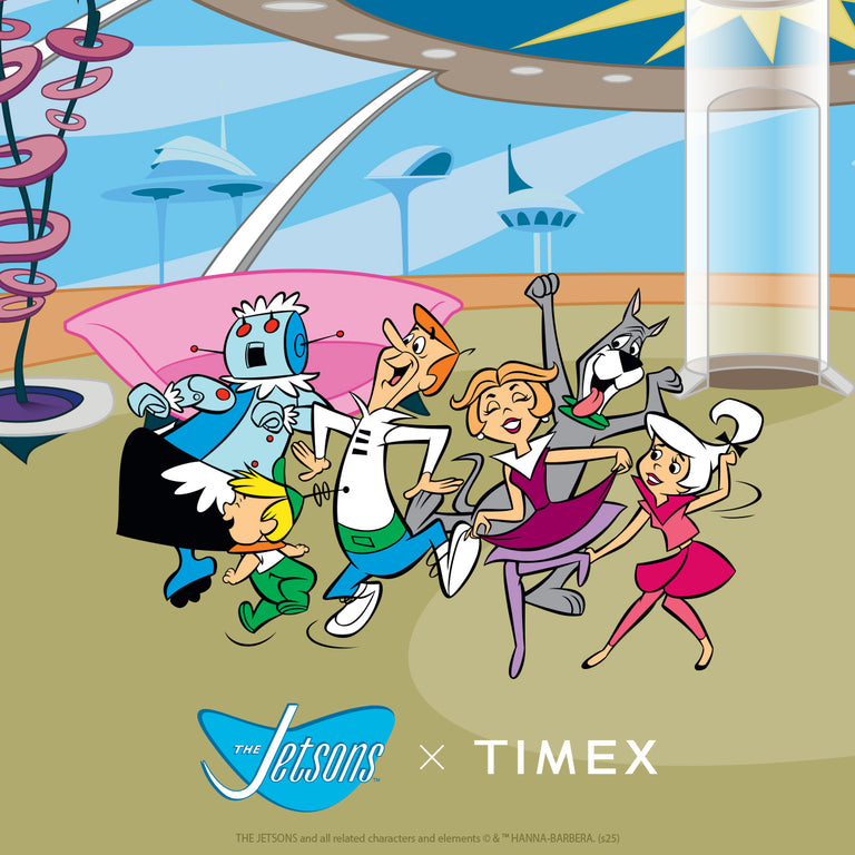 An illustration of the Jetsons family—George, Jane, Judy, Elroy, Astro the dog, and Rosie the robot—joyfully running together inside their futuristic home. The background features sleek, space-age architecture. At the bottom, the Jetsons logo appears next to the Timex logo, representing the Timex x Jetsons collaboration.