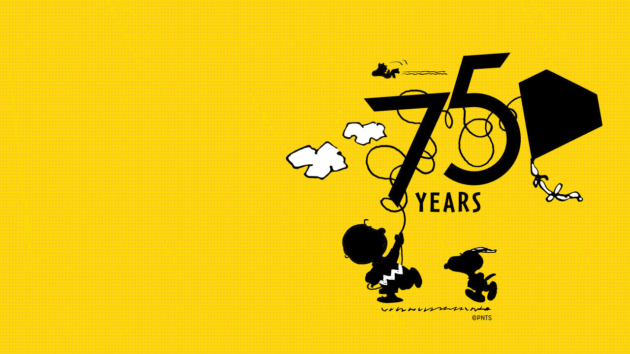 Bright yellow Peanuts 75th Anniversary illustration featuring Charlie Brown flying a kite tangled in the number “75” while Snoopy and Woodstock look on. The design celebrates 75 years of the beloved Peanuts comic strip.