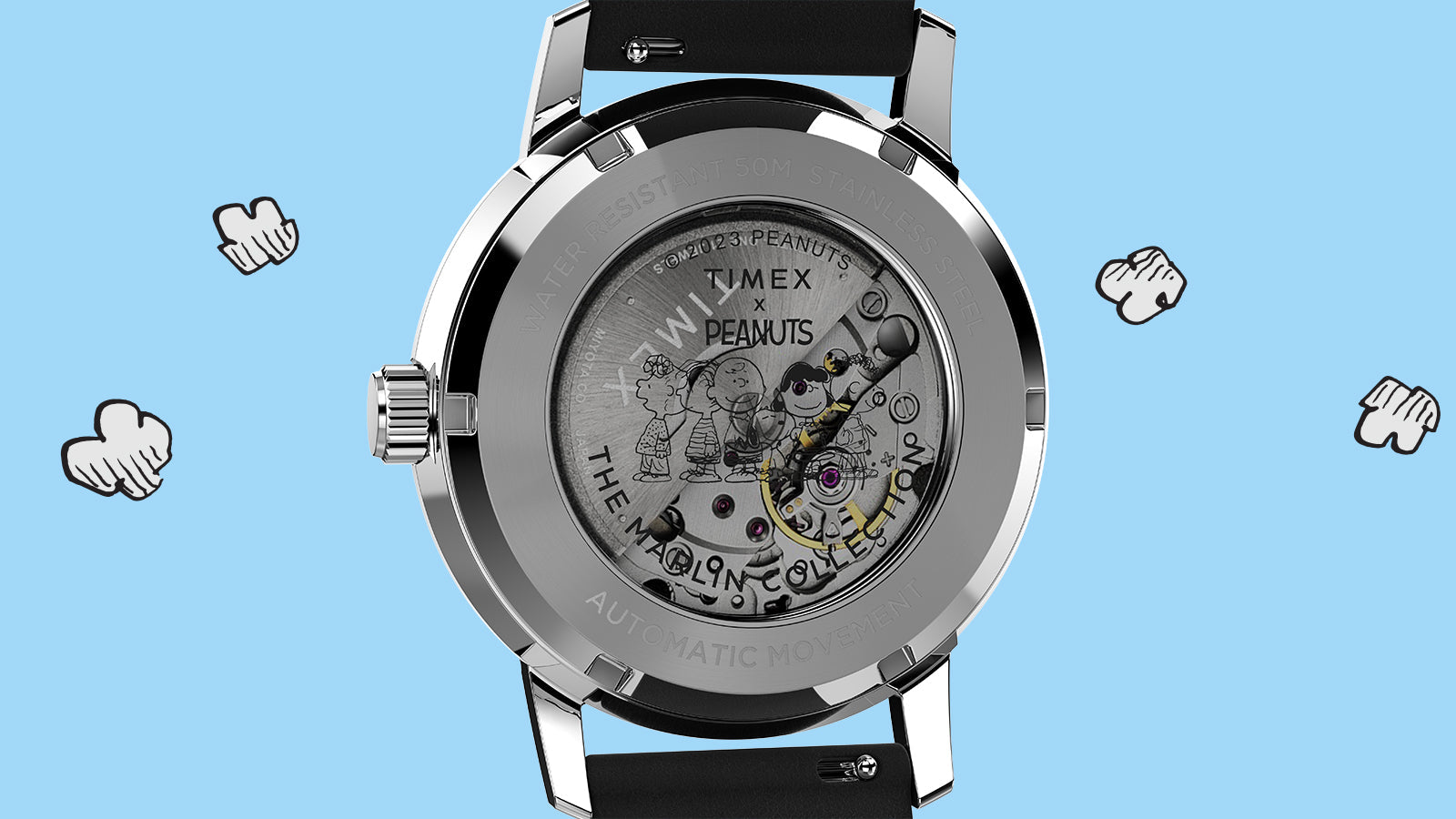 Rear view of the Timex Marlin® Automatic x Peanuts Snoopy Flying Ace watch showing the exhibition caseback with visible automatic movement. The transparent back is etched with Peanuts characters, including Charlie Brown and Lucy, highlighting the collaborative design.