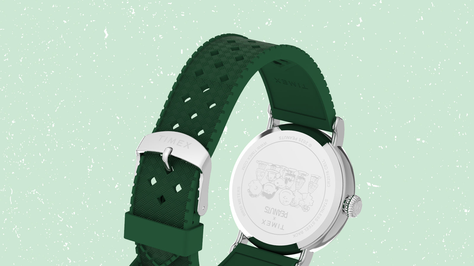 Rear view of the Timex x Peanuts® Standard watch showing its textured green strap and polished stainless-steel buckle engraved with the Timex logo. The caseback is etched with the Peanuts gang, celebrating the timeless collaboration.