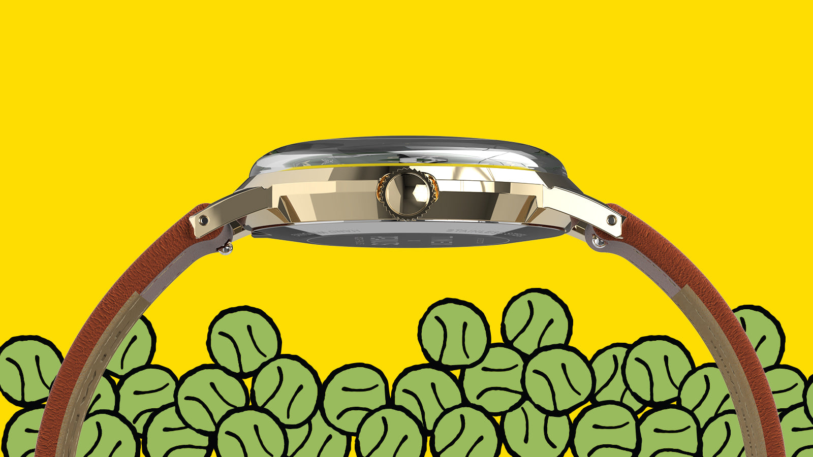 Side view of the Peanuts® x Timex Marlin® Hand-Wound watch highlighting its domed crystal, gold-tone case, crown, and brown leather strap above illustrated tennis balls.