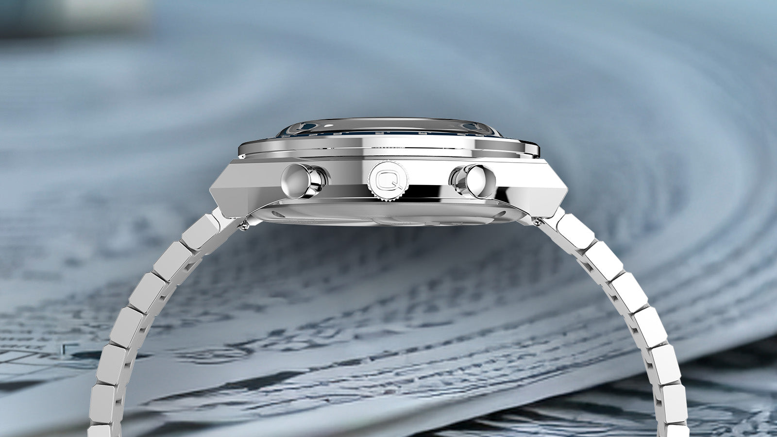 Side profile view of the Q Timex Chronograph highlighting its slim stainless steel case, pushers, and crown engraved with the Q logo.