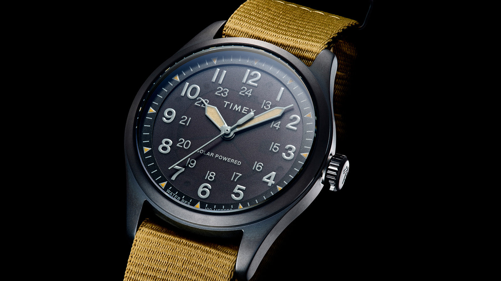 Angled front view of the Timex Expedition Field Post Solar watch highlighting the black dial, luminous hands, crisp numeral design, and matte black case.