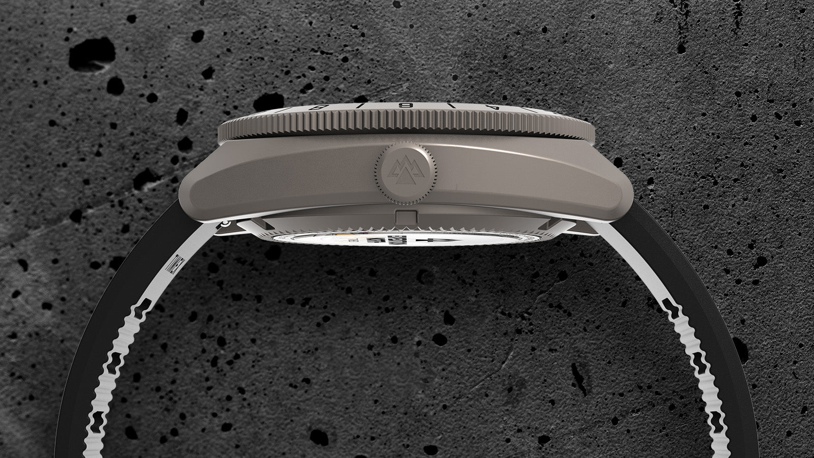 Side view of the Timex Expedition North GMT Titanium Automatic, highlighting its brushed titanium case, engraved crown, and slim black strap.