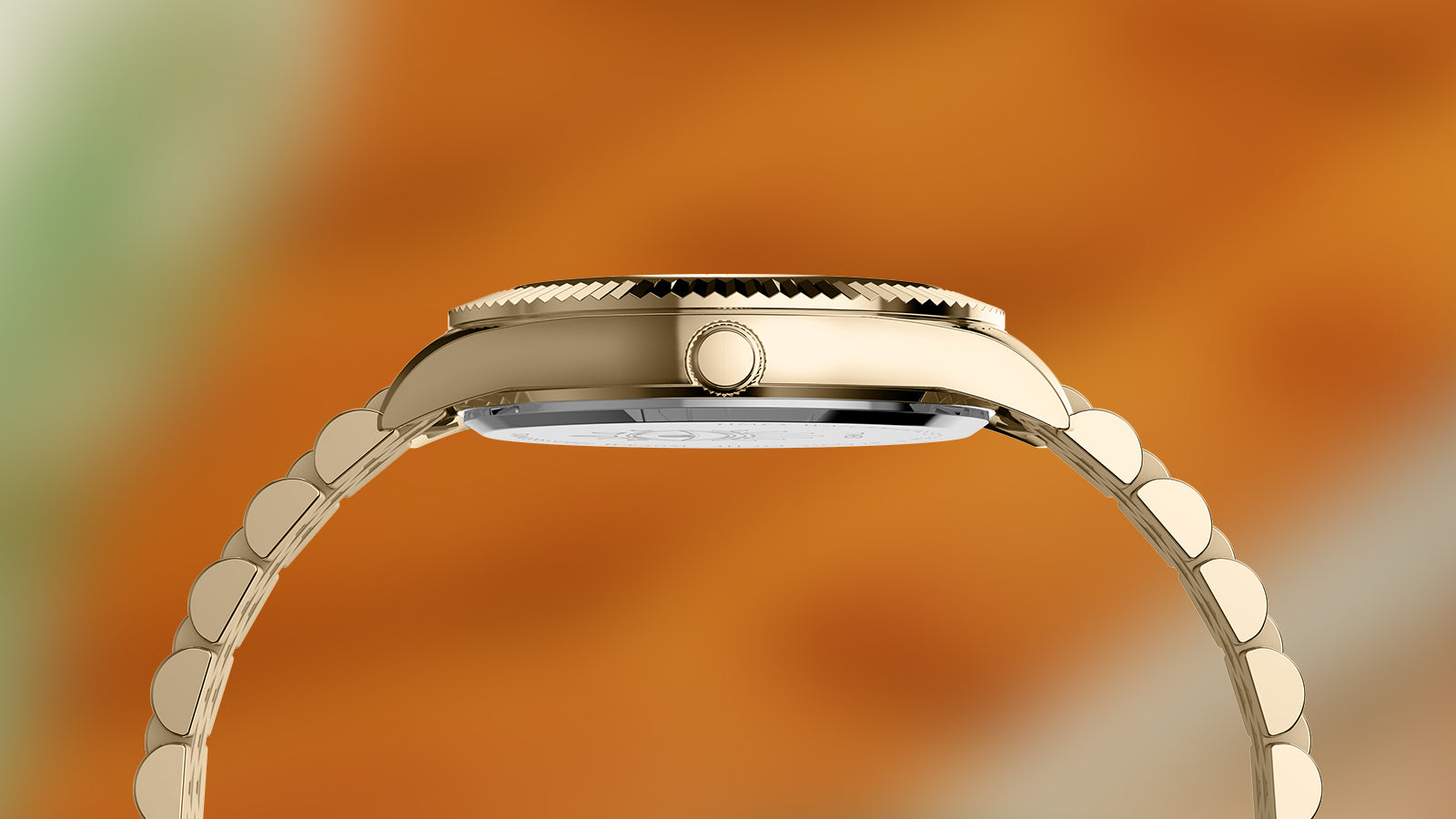 Side view of the Timex x Jacquie Aiche “Desert Daze” watch showing its slim gold-tone case and textured bezel design against a warm, sunlit desert-inspired background.