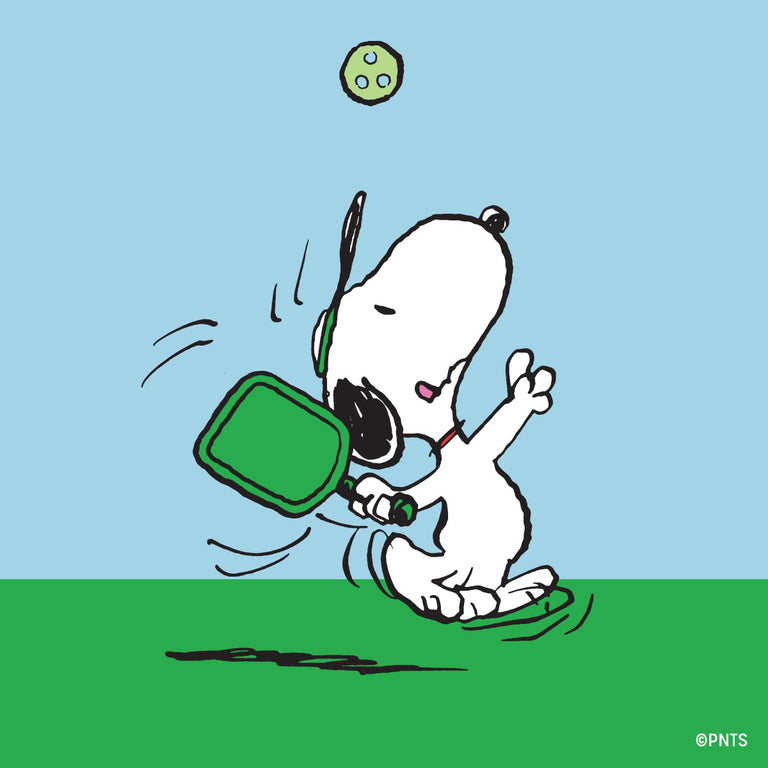 Illustration of Snoopy playing pickleball with green paddle and ball, artwork featured on the Peanuts® x Timex Marlin® Pickleball watch dial.