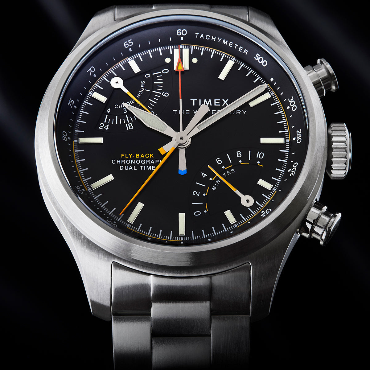 Close-up of Timex Waterbury Ace Fly-Back Chronograph dial showing subdials, tachymeter scale, and luminous hands