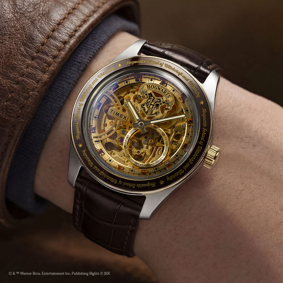 Harry Potter x Timex Waterbury Skeleton Automatic watch worn on wrist showing gold-tone skeleton dial and Hogwarts detailing.