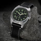 Timex Expedition Capstone watch with black dial and black leather strap on rock surface