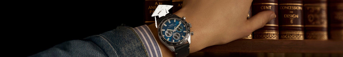 Timex Waterbury Traditional Chronograph watch with blue dial, silver-tone case, and black leather strap on wrist.