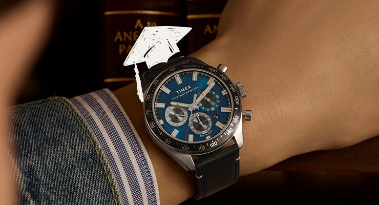 Timex Waterbury Traditional Chronograph watch with blue dial, silver-tone case, and black leather strap on wrist.