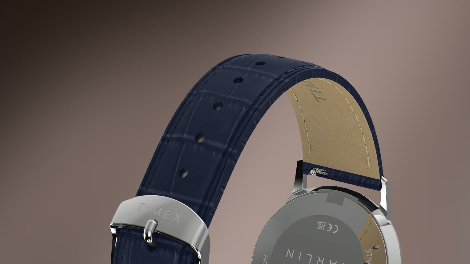 Close-up of the Marlin America 250 blue leather strap with crocodile-grain texture and stainless-steel Timex buckle.