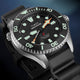 Close-up angled view of the Timex Deepwater Meridian 300 Titanium HEV Automatic showcasing luminous markers, titanium case, and black rubber strap.