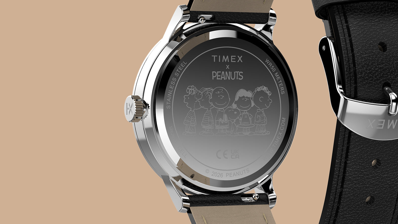 Caseback of the Peanuts® x Timex Waterbury Classic watch featuring an engraved Peanuts group illustration and Timex x Peanuts branding.