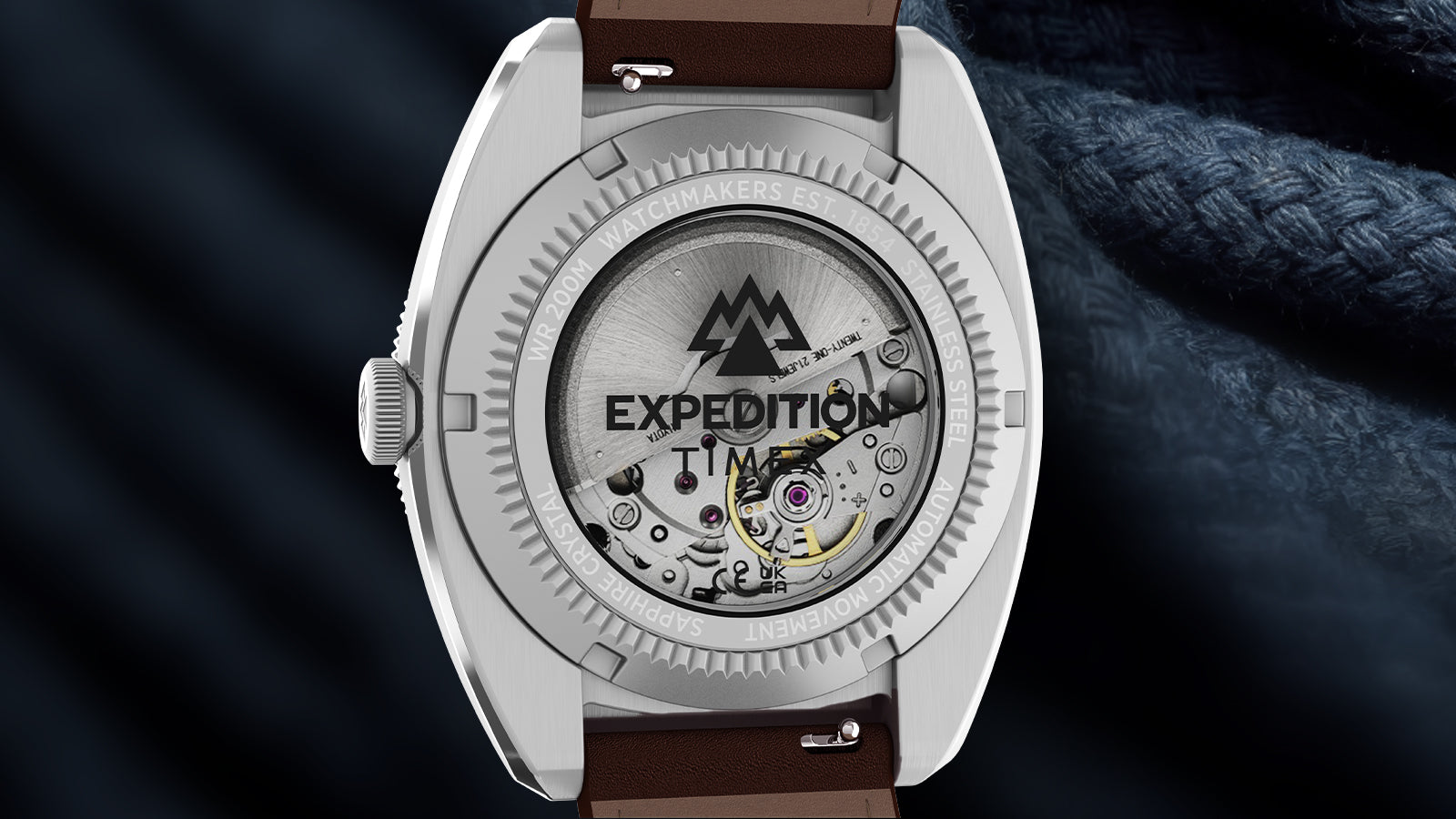 Caseback of the Timex Expedition Pioneer Automatic showing the automatic movement through a transparent exhibition window and brown leather strap.