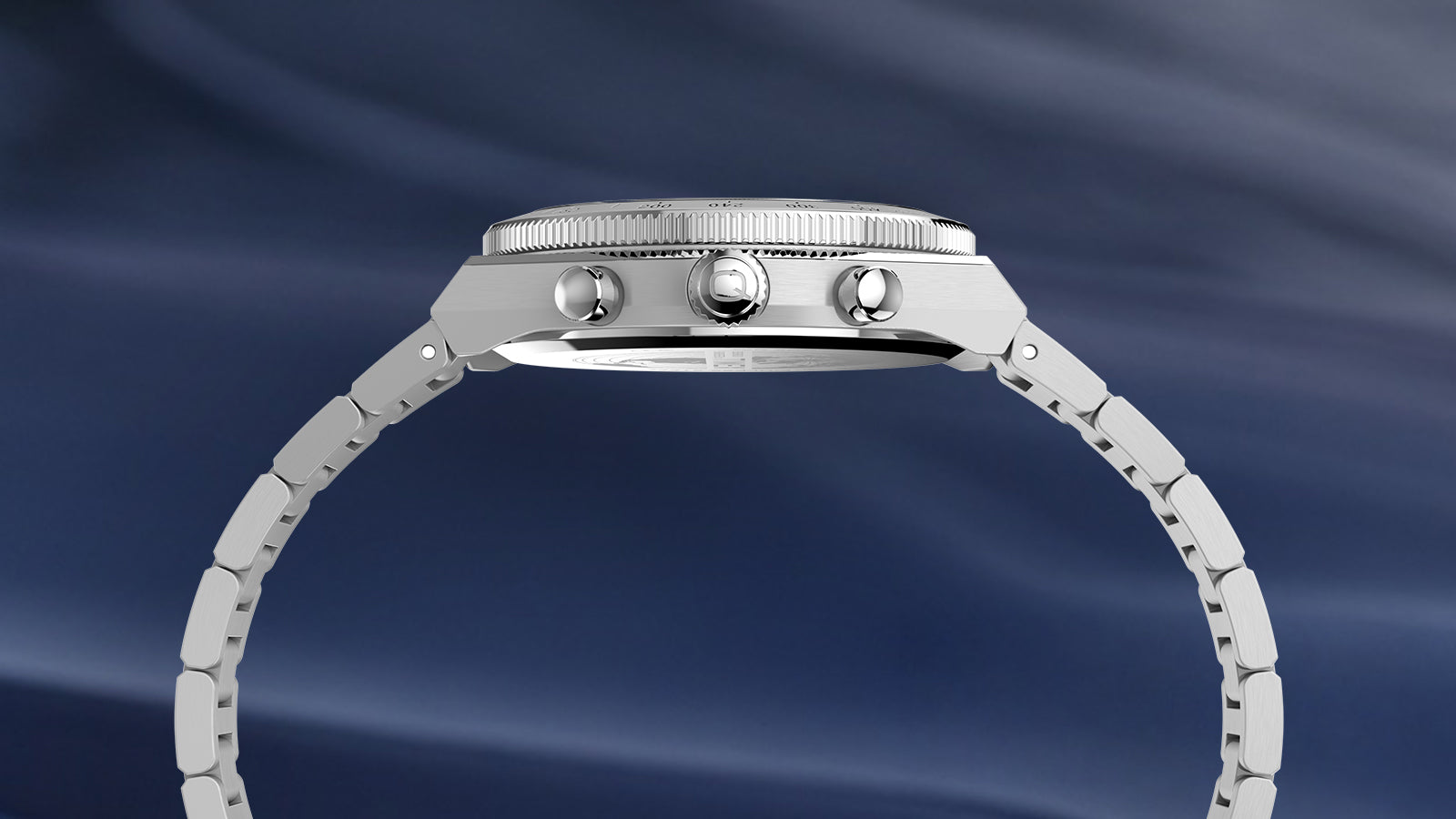 Side view of the Q Timex Continental Chronograph showing its stainless-steel case, crown, chronograph pushers, and bracelet.