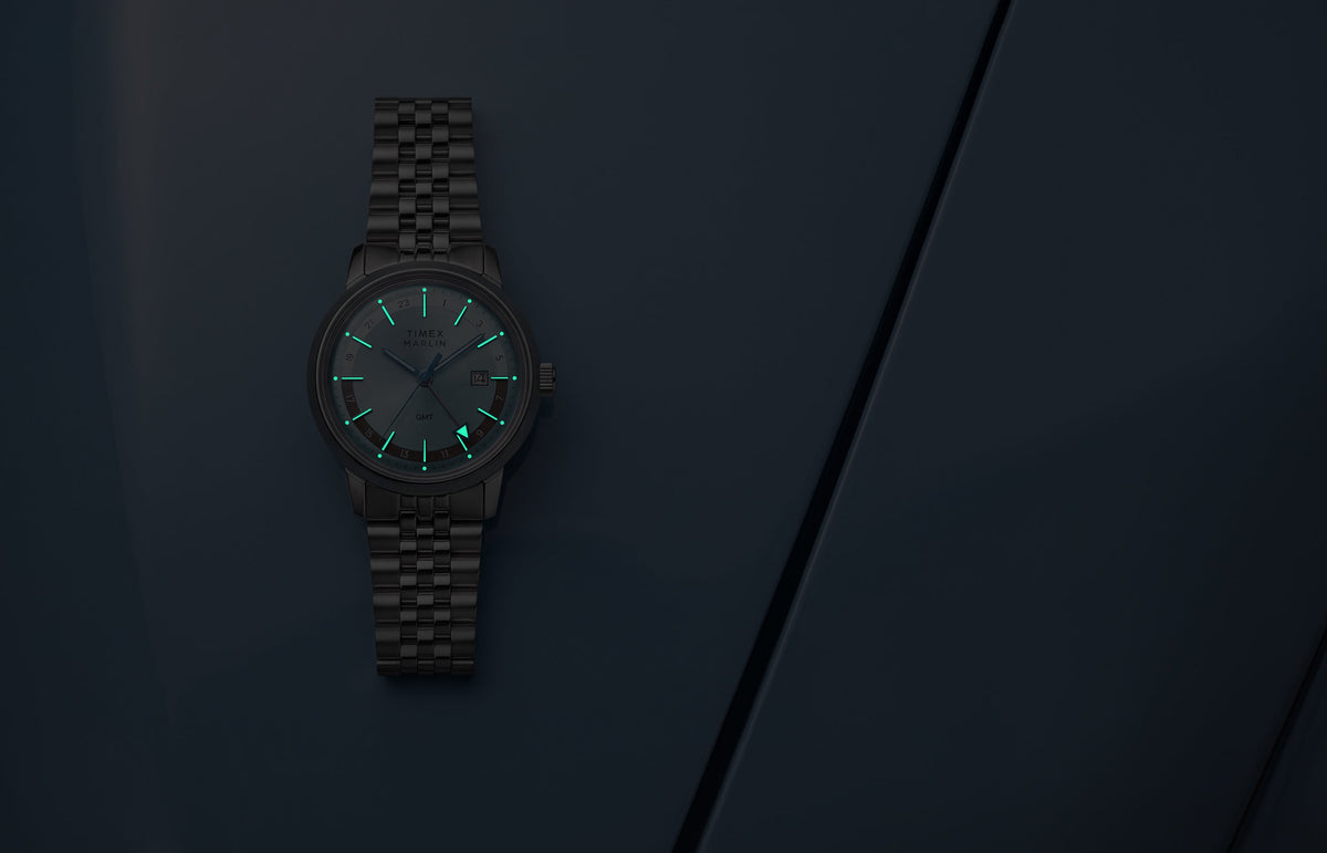 Marlin® Quartz GMT in low light with glowing hour markers and GMT hand.