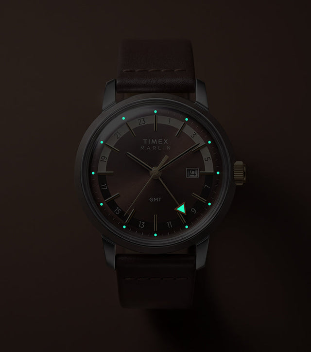 Marlin® Quartz GMT in low light with glowing hour markers and GMT hand.