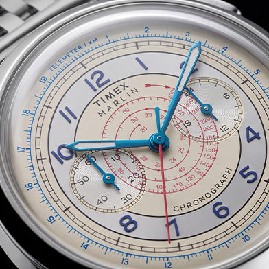 Close-up of the Marlin® Neo Classic Chronograph with a cream multiscale dial and blue Arabic numerals.