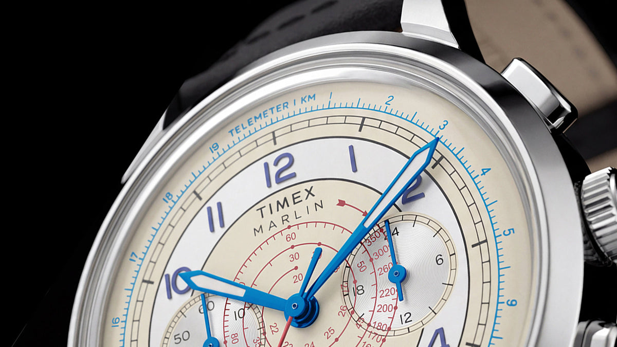 Angled close-up of the Marlin® Neo Classic Chronograph, highlighting its blue hands, red scales, and chronograph subdials.