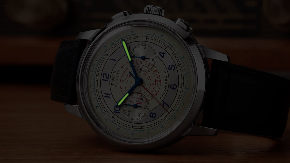 Close-up of the Marlin® Neo Classic Chronograph in low light with green luminous hands.