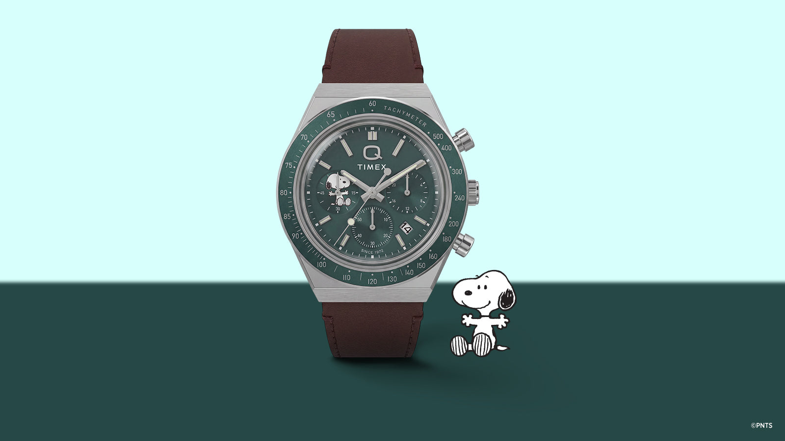 Front view of the Peanuts® x Q Timex Chronograph with a green dial, Snoopy subdial, tachymeter bezel, and brown leather strap.