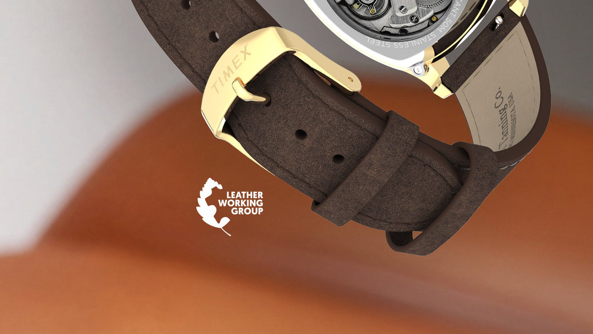 TW2Y84500 Brown leather strap and gold-tone buckle of the Marlin® Chatham Automatic watch beside the Leather Working Group logo.