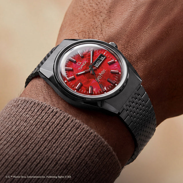 TW2Y99700 Harry Potter x Q Timex watch with a red Sorcerer’s Stone-inspired dial and black bracelet worn on the wrist.