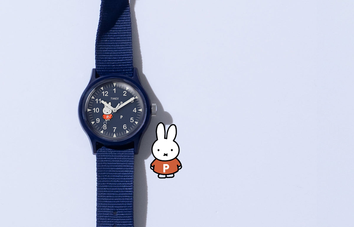 TW6A31000 Pop & Miffy by Timex MK1 watch with a navy fabric strap and Miffy dial, beside a Miffy illustration.