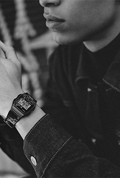 A man showing hi Timex T80 x Keith Haring 34mm Resin Strap Watch in his wrist