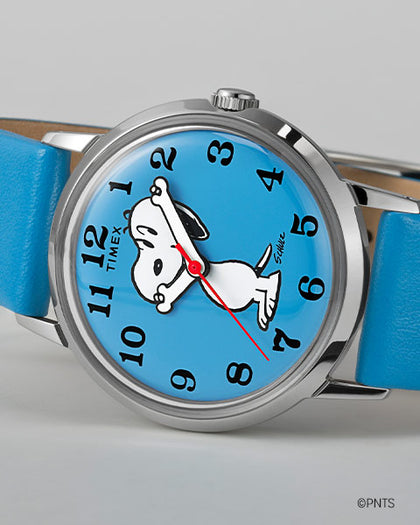 Timex x Peanuts Reissue with Snoopy on a blue dial laying on its side