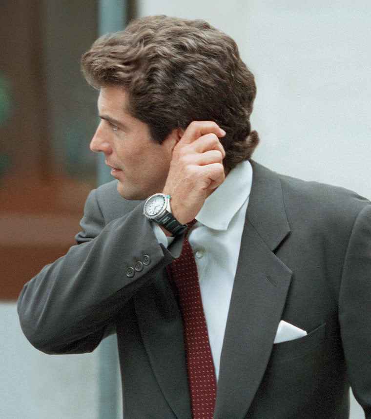 A guy looking sharp in suit flaunting his Timex JFK Watch