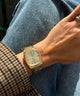 TW2Y07200 Timex® Automatic 1983 E Line Reissue 34mm Gold-Tone Expansion Band Watch Primary Wrist Image