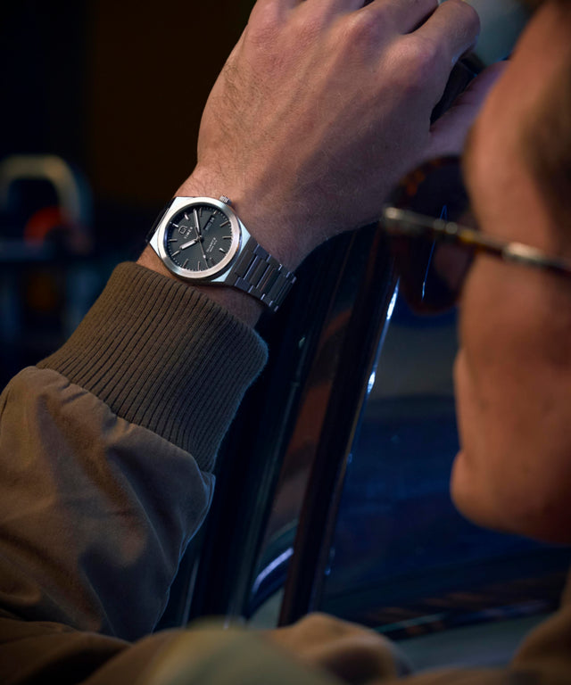 TW2Y25000 Q Timex® Continental Day and Date 39mm Stainless Steel Bracelet Watch Alt Wrist Shot 2 Image