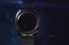 The video shows diferent sides and close up shots of Q Timex 1975 Enigma Reissue Watch in a galaxy-like night sky background