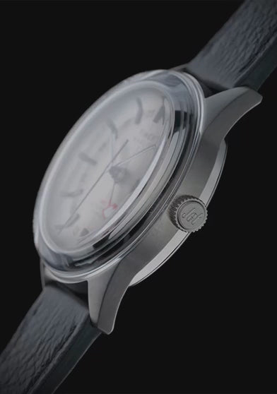 Timex Marlin® Jet Titanium Automatic GMT, highlighting its lightweight titanium case, automatic GMT movement, exhibition caseback, cream dial, and black leather strap from multiple angles.