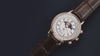 Timex 1990 Moon Phase and Calendar Dial Reissue transitions from an angled close-up to a centered full view against a dark background.