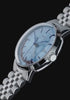 close-up views of the Marlin® Quartz GMT with an icy blue dial and stainless-steel bracelet against a black background.