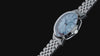 close-up views of the Marlin® Quartz GMT with an icy blue dial and stainless-steel bracelet against a black background.