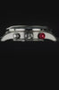 Timex Waterbury Heritage Chronograph with a stainless steel case, black leather racing strap, panda-style chronograph dial, black tachymeter bezel, and signature red chronograph pusher through rotating product views and detailed close-ups.