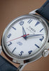Marlin America 250 watch video highlighting the white dial, blue accents, red seconds hand, stainless-steel case, and blue leather strap inspired by American heritage.