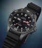 Timex Deepwater Meridian 300 Titanium HEV Automatic featuring a diver exploring a coral reef, detailed views of the titanium case, rotating bezel, black dial, and glowing lume in low light.