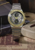 TW2Y75900 Moving close-ups of the silver-tone watch beside a Time-Turner pendant and books; the hands and hour markers glow as the lighting changes.