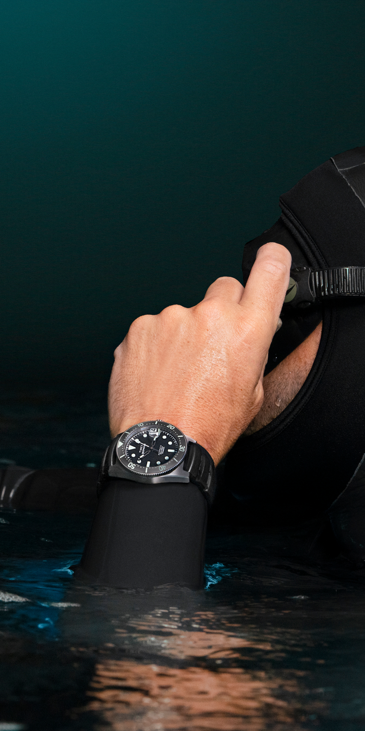 An Image of Timex Deepwater Watch worn by a Male Diver